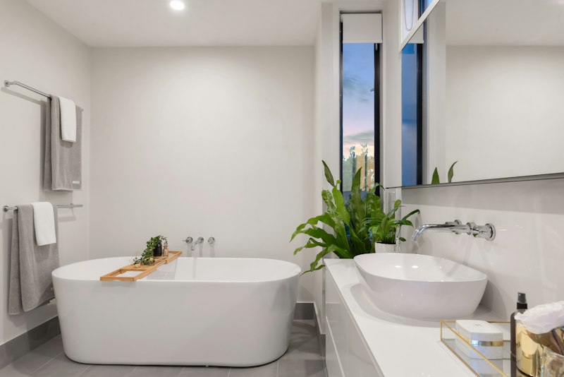 Contemporary bathroom with freestanding bath, countertop basin and vanity